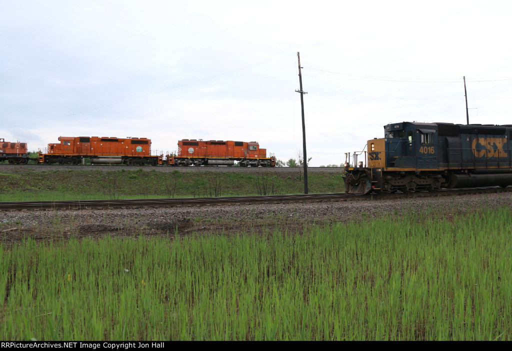 A pair of EJ&E SD38-2's work their old home rails as a CSX job passes in front